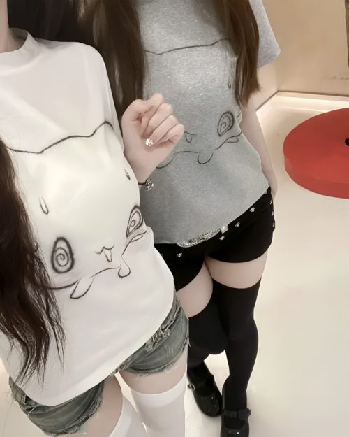 Grey t-shirt with a drawn nervous neko design. Nervous Neko T-Shirt.