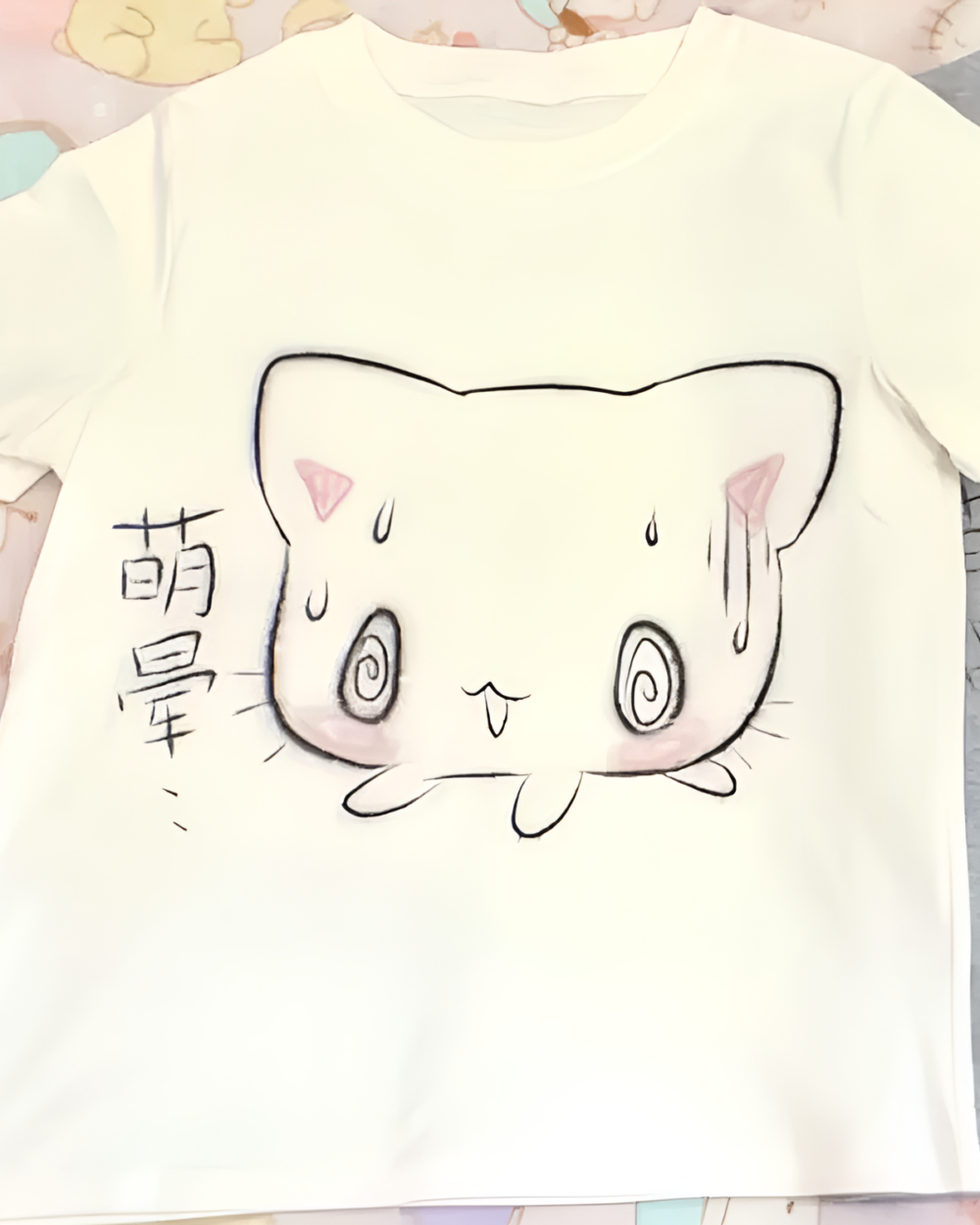 White t-shirt with a black illustration of a nervous cat face, a Nervous Neko T-Shirt.