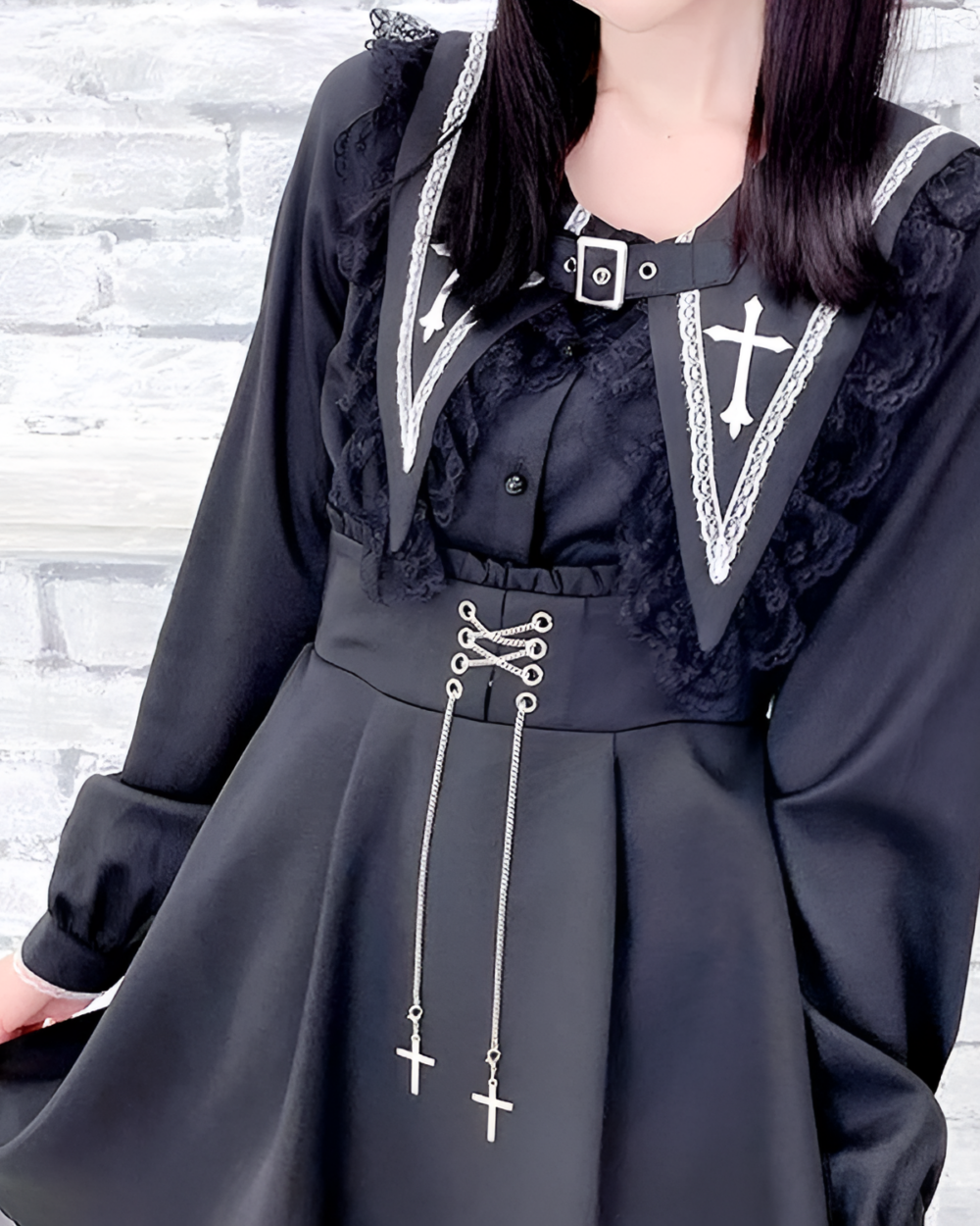 Black long sleeve Jirai Kei blouse with lace and cross details. Features a high collar and adjustable waist ties.