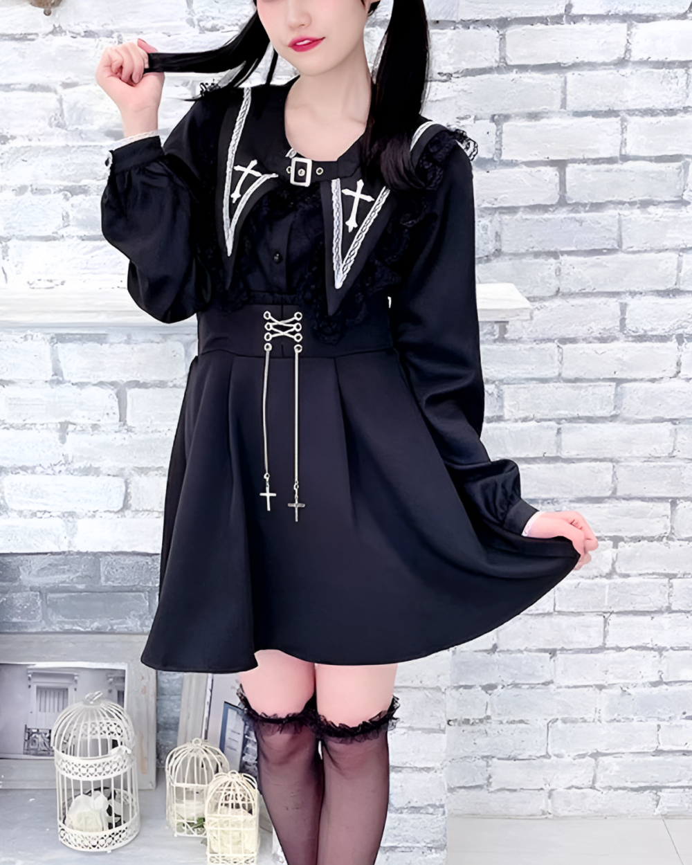 Model wearing a black Nocturne Cross-Collar Jirai Kei blouse with lace details and long sleeves. A goth aesthetic fashion piece.