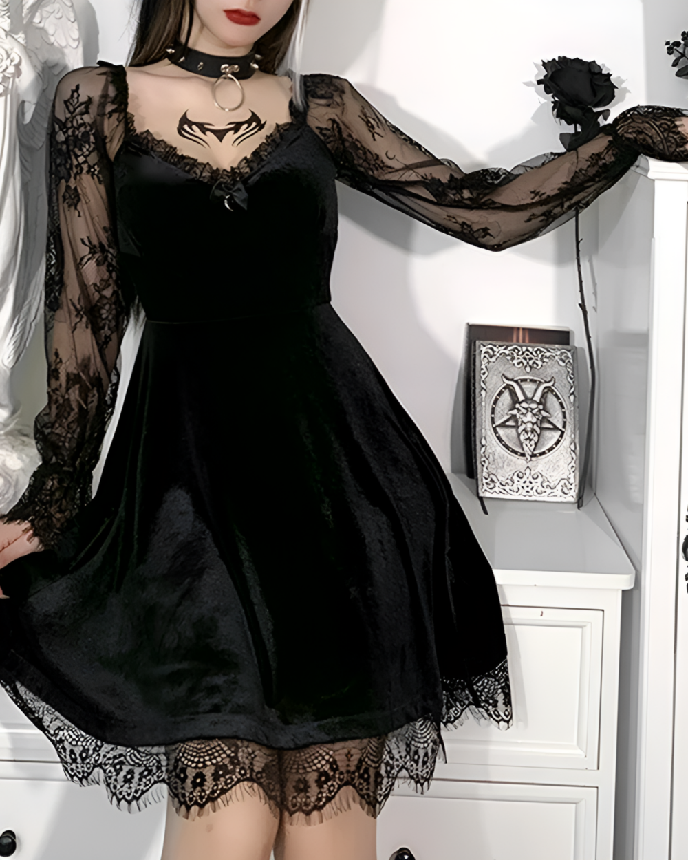 Black velvet Nocturne Moon-Charm Skater Dress with lace details and long sleeves. Features a fitted bodice and flared skater skirt.