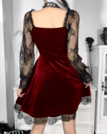 Back view of the Nocturne Moon-Charm Skater Dress, a red velvet dress with lace sleeves and hem.