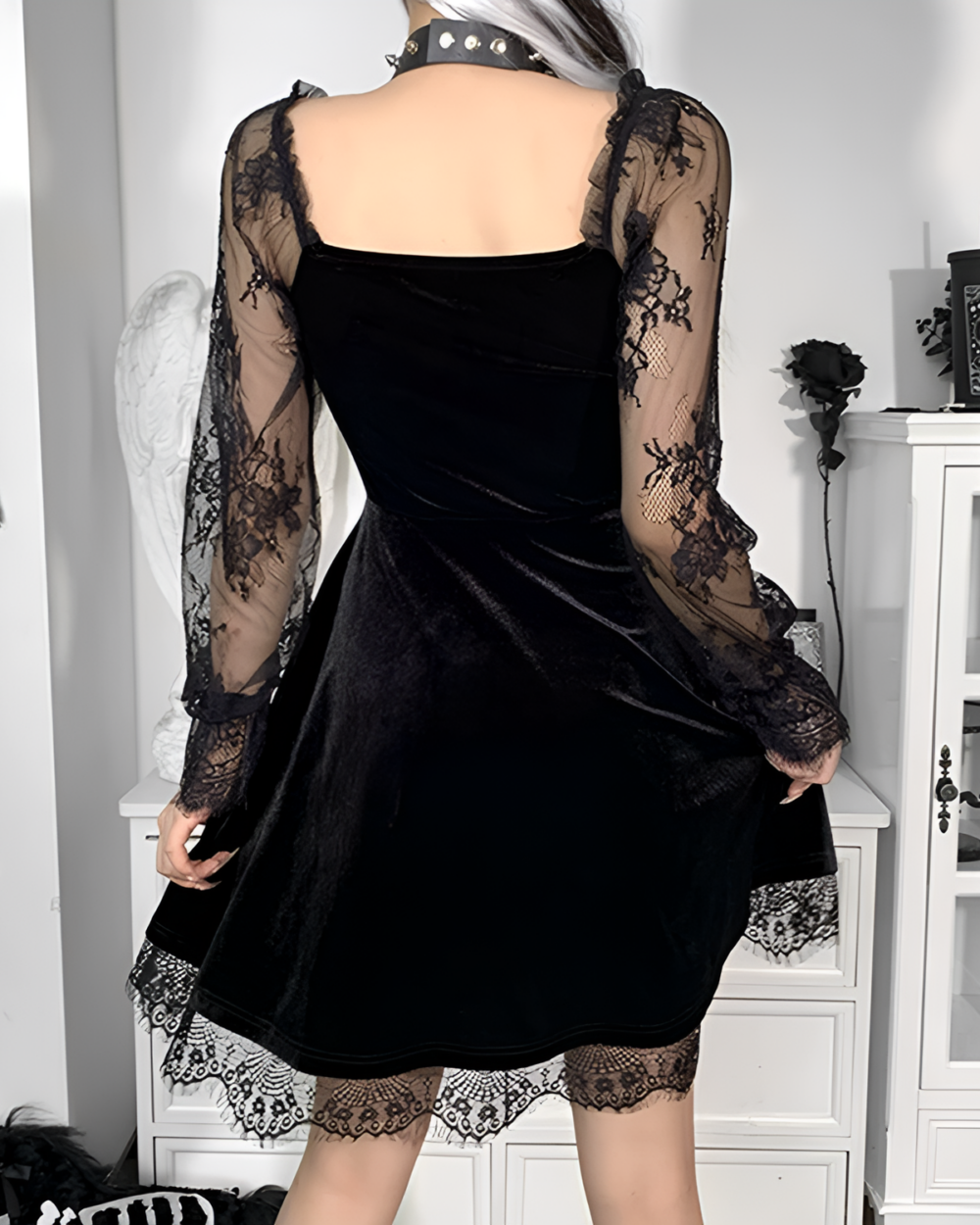 Back view of the Nocturne Moon-Charm Skater Dress, a black velvet skater dress with lace sleeves and hem detailing.