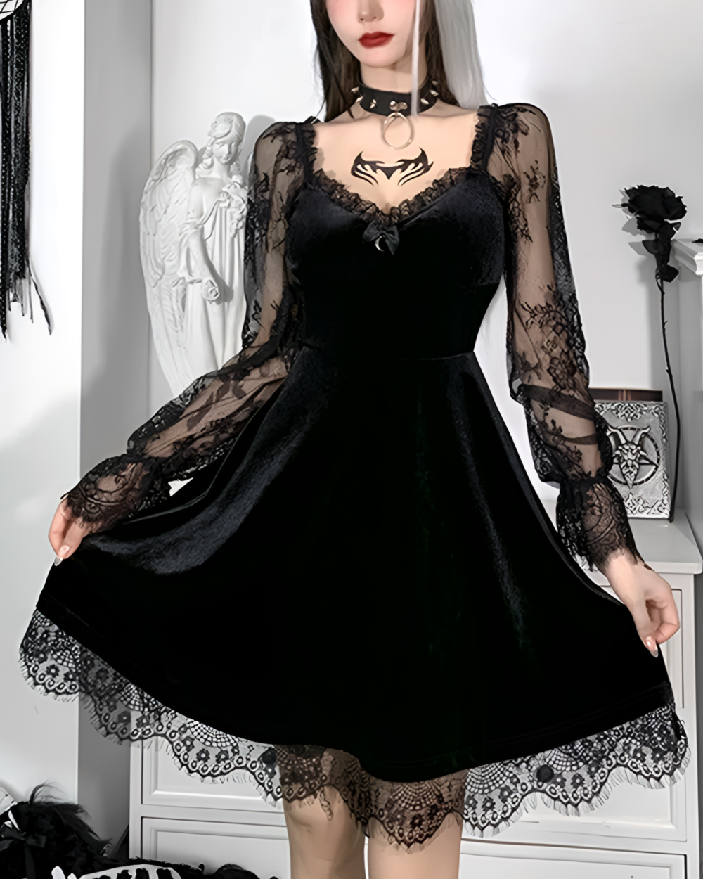 Woman wearing a black Nocturne Moon-Charm Skater Dress with lace details. Velvet and sheer sleeves.