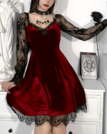 Woman wearing a red velvet Nocturne Moon-Charm Skater Dress with lace details and sheer sleeves.