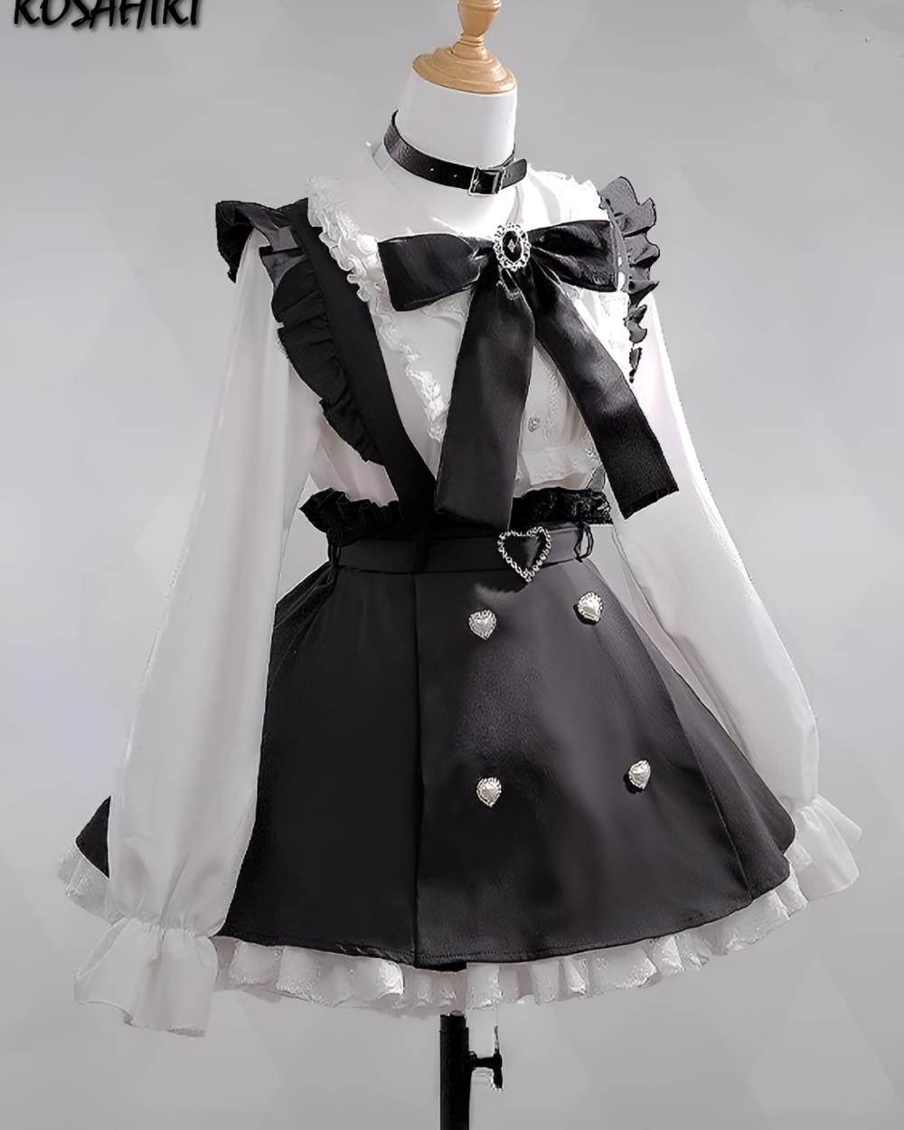 Noir Pearl Pinafore Coord, showcasing a black and white Jirai Kei aesthetic with ruffles and a bow. Ideal for fans of the style.