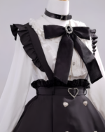 Noir Pearl Pinafore Coord, showcasing a black and white outfit with a distinctive Jirai Kei aesthetic. Includes a ruffled blouse, suspenders and a high-waisted skirt.