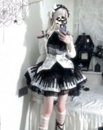 Model wearing the Noir Sonata Skirt, a black and white piano key skirt with lace trim and a maid-style outfit.