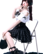Model wearing Off-Shoulder Blouse & SK Set with a Jirai Kei aesthetic. White top with black plaid skirt and accessories.