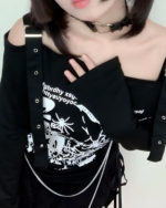 Black Nu-Goth sweater with off-shoulder neckline and straps.