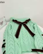 Mint knit set featuring a textured, cable-knit design with a bow detail.
