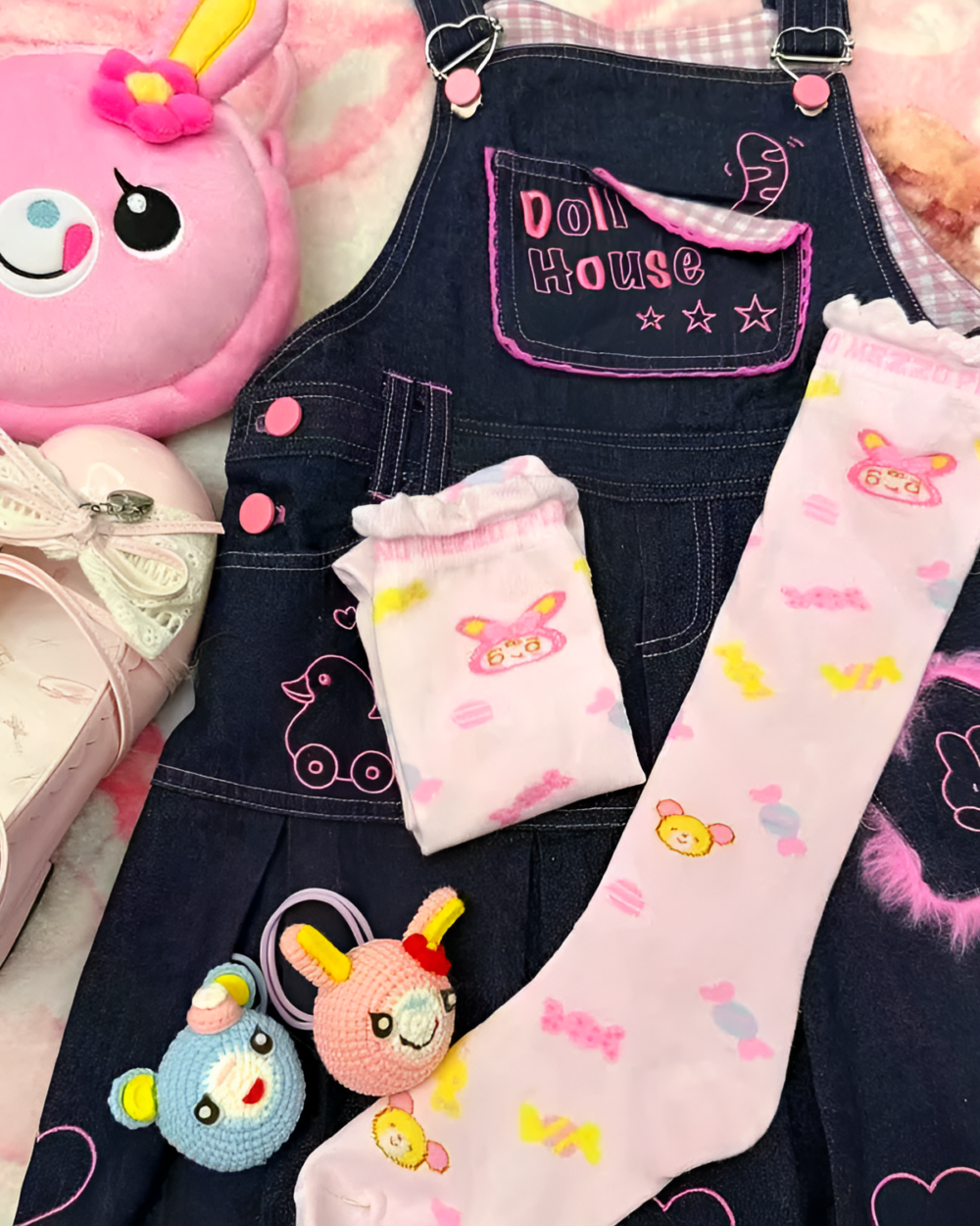 Pink Lolita socks displayed with a dollhouse denim outfit and other accessories.