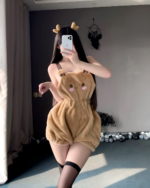 A woman wearing cute pajamas, a plushie bear design, featuring a hood and ears.