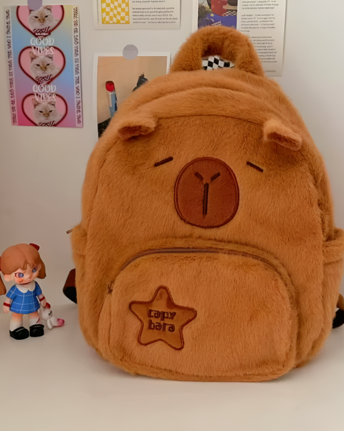 Brown plushie bag featuring a Capybara plushie design and zipper closure.