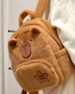 Brown Capybara plushie backpack, soft and cute design.