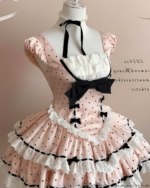 Polka dotted Hime Lolita dress with ruffled details and a black bow. Pink and white color scheme. Displayed on a mannequin.