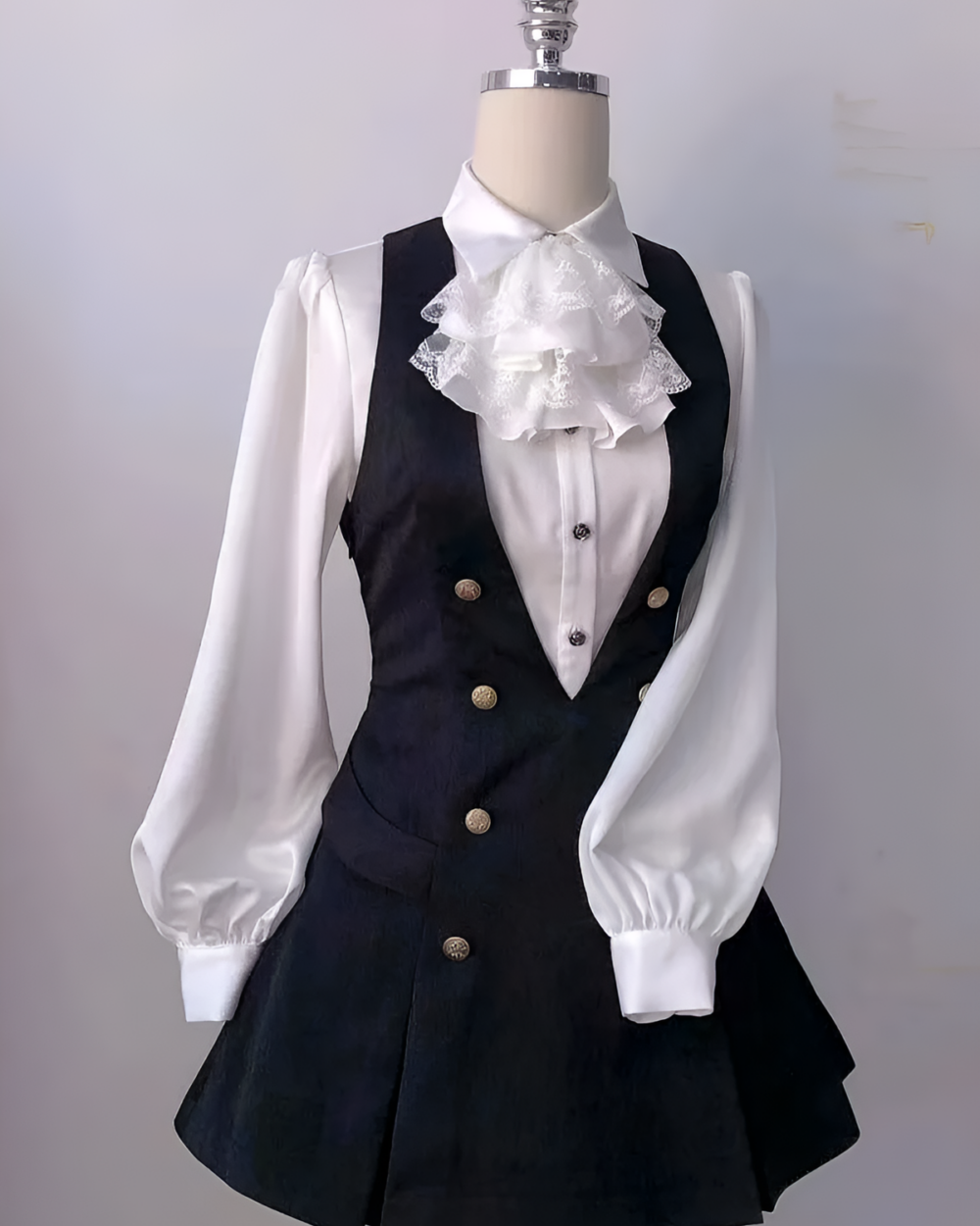 White blouse and black Ouji aesthetic dress set with frilled collar and matching vest.