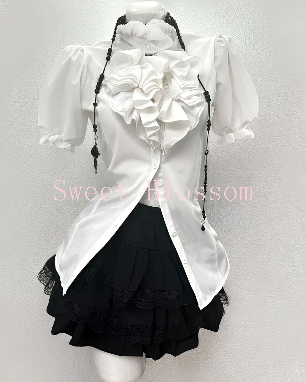 White and black Ouji aesthetic dress set with ruffled blouse and lace skirt.