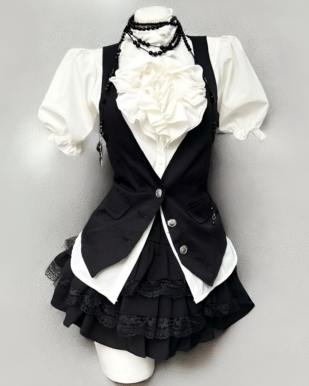 Preppy Style Dress Set - Ouji Aesthetic product photo 1 Black and white Ouji aesthetic dress set with a vest, blouse, and skirt.