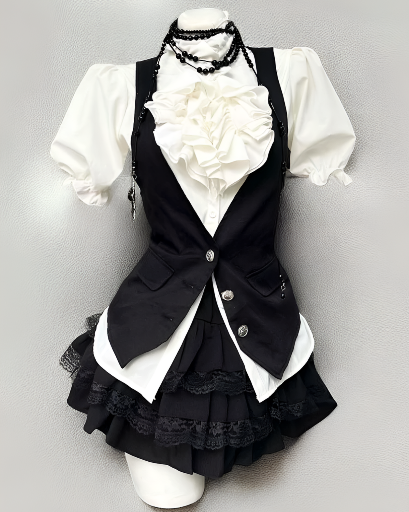 Black and white Ouji aesthetic dress set with a vest, blouse, and skirt.