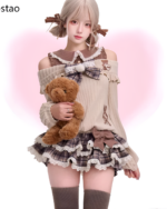 A model wears a Preppy Sweet Lolita Set - Dollette Aesthetic, featuring a teddy bear and layered skirt.
