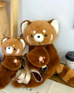 Red Panda Plush Backpack featuring a brown plush panda with a strap.