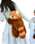 Brown Red Panda Plush Backpack worn as a sling bag by a woman.