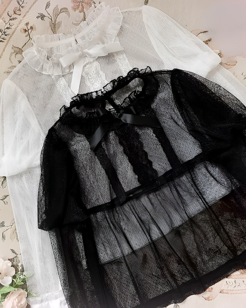 Black and white Hime Lolita blouse with sheer mesh and lace details.