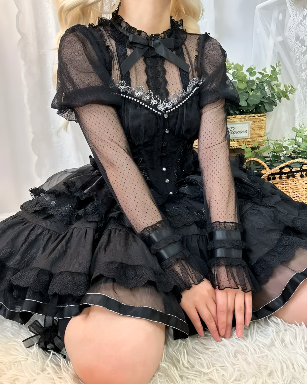 Black Hime Lolita blouse with lace, sheer sleeves, and a ruffled skirt.