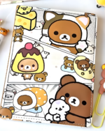 Rilakkuma notebook featuring Rilakkuma and friends illustrations on a lined page.
