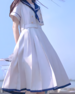 White sailor uniform dress (Nanchatte Seifuku) with blue trim, pleated skirt and belt.