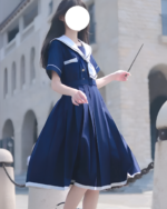 A navy blue sailor uniform dress, also known as Nanchatte Seifuku, worn outdoors.