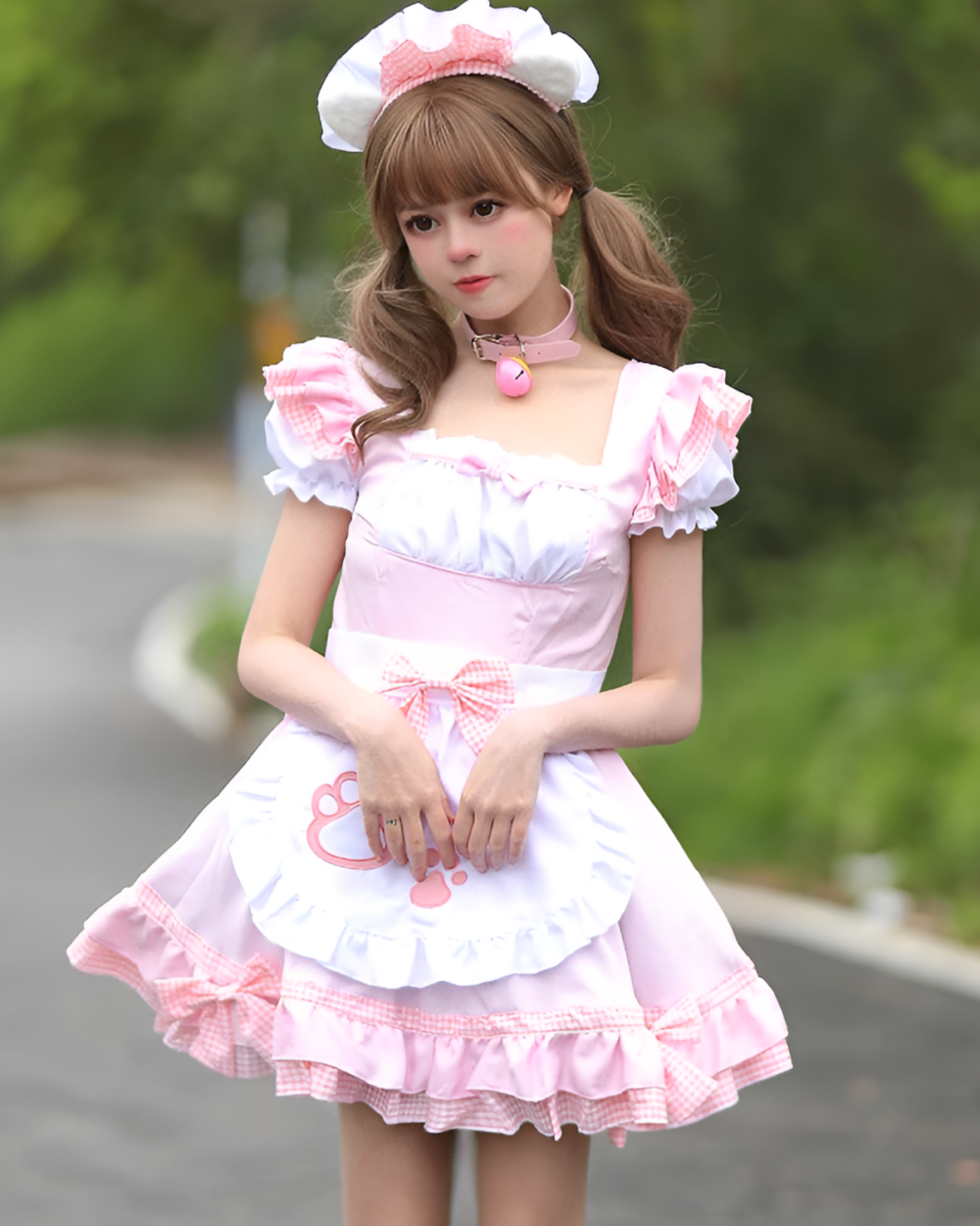 Model wearing a pink Soft Girl Maid Dress - Paw Prints Edition, complete with a matching bonnet and accessories.