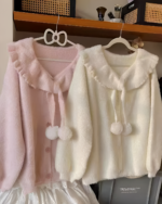 Two soft girl sweaters, a pink and a white, featuring faux fur details and pom-poms. Soft and Sweet Knitted Sweater