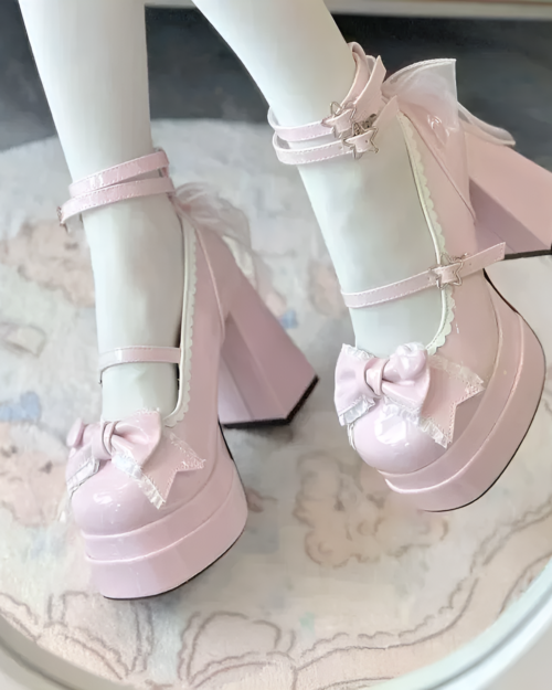 Close-up of pink Starlit Lace-Bow Mary Janes with star and bow details on a platform heel.