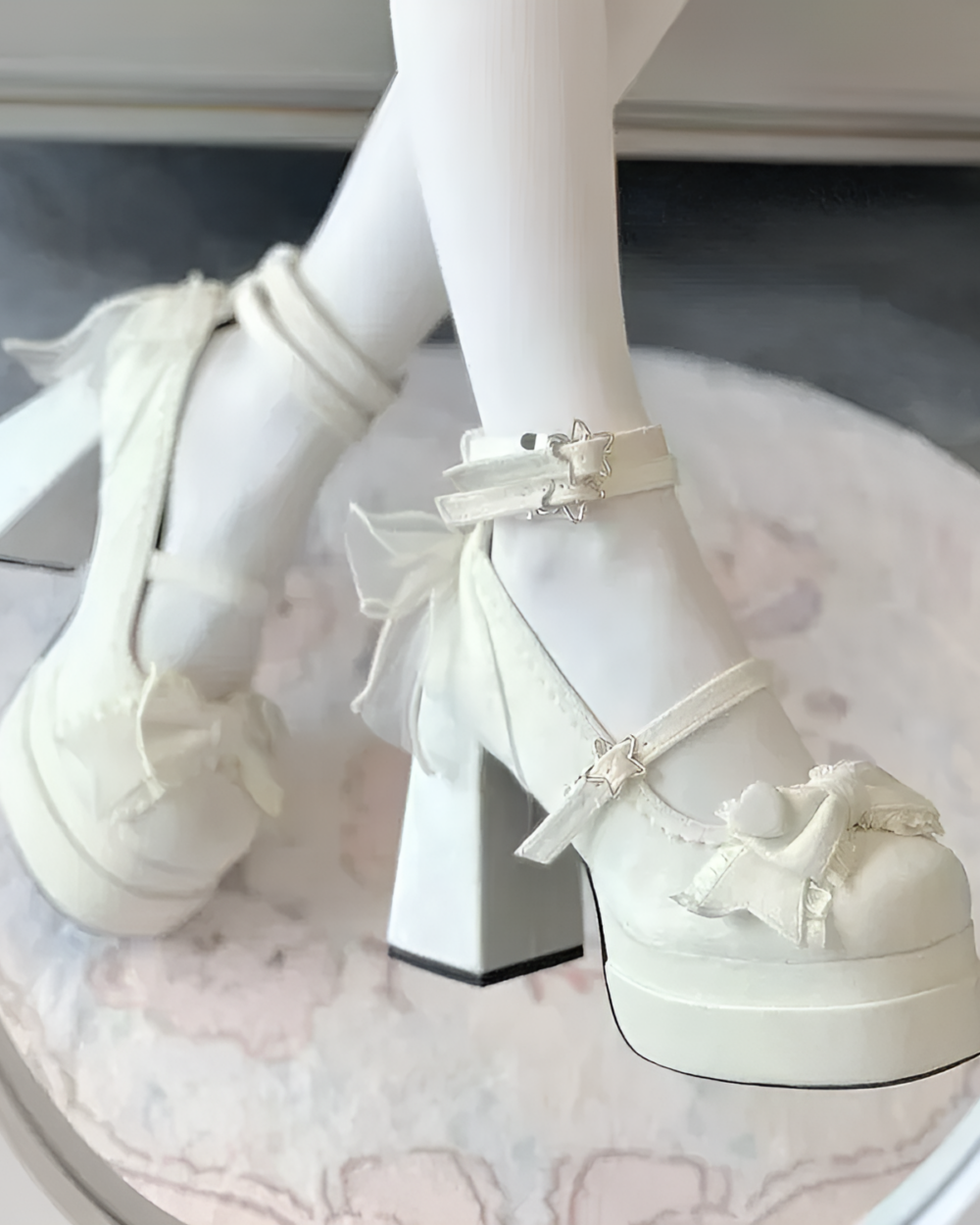 Close-up of white Starlit Lace-Bow Mary Janes with ankle straps and star details, worn with white socks.
