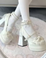 Close-up of white Starlit Lace-Bow Mary Janes with ankle straps and star details, worn with white socks.