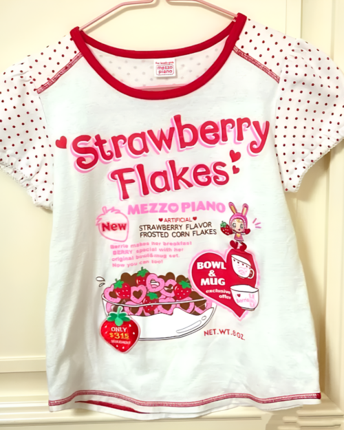 Kawaii Strawberry Flakes graphic tee featuring a strawberry and flakes design.