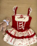 Red and white Strawberry Parfait Dress with lace details and a teddy bear.