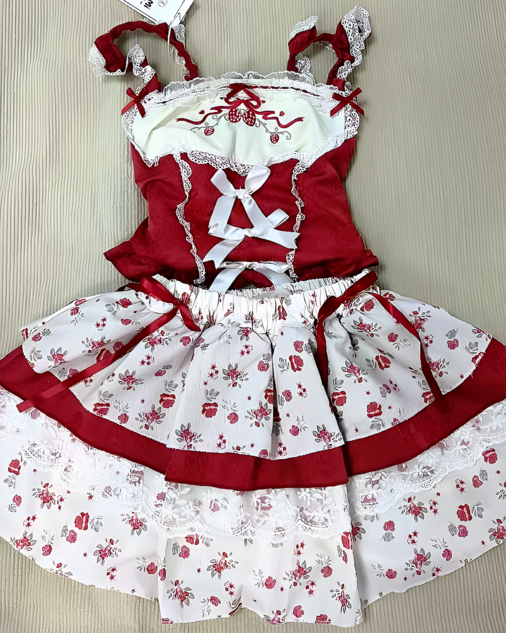 Red and white Strawberry Parfait Dress with floral pattern and lace details.