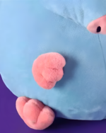 Close-up of a blue Stupid Rat Plushie with pink ears and tail.