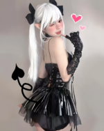 Model wearing a Succubus Bat-Wing Corset Set with black bat wings, gloves & a tail. The set includes a corset and skirt.