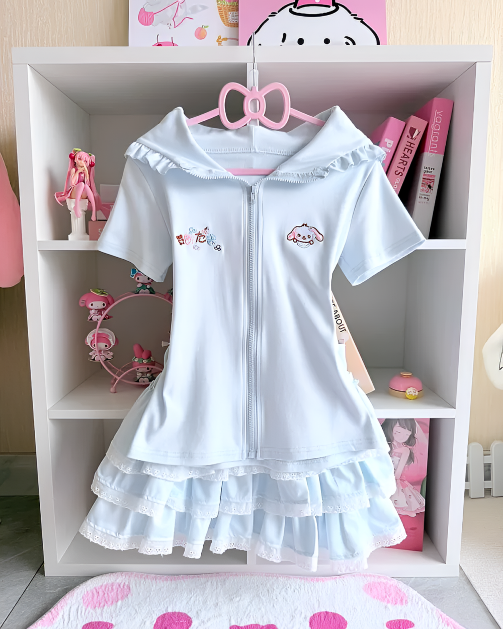 Light blue Sugarcloud Ruffle-Zip Coord displayed on a white shelf. Features a cute design, perfect for a Yume Kawaii Coord aesthetic.