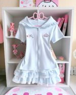 Light blue Sugarcloud Ruffle-Zip Coord displayed on a white shelf. Features a cute design, perfect for a Yume Kawaii Coord aesthetic.