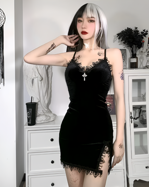 Woman wearing a black velvet goth mini dress with lace details. A stylish summer outfit with a dark aesthetic.