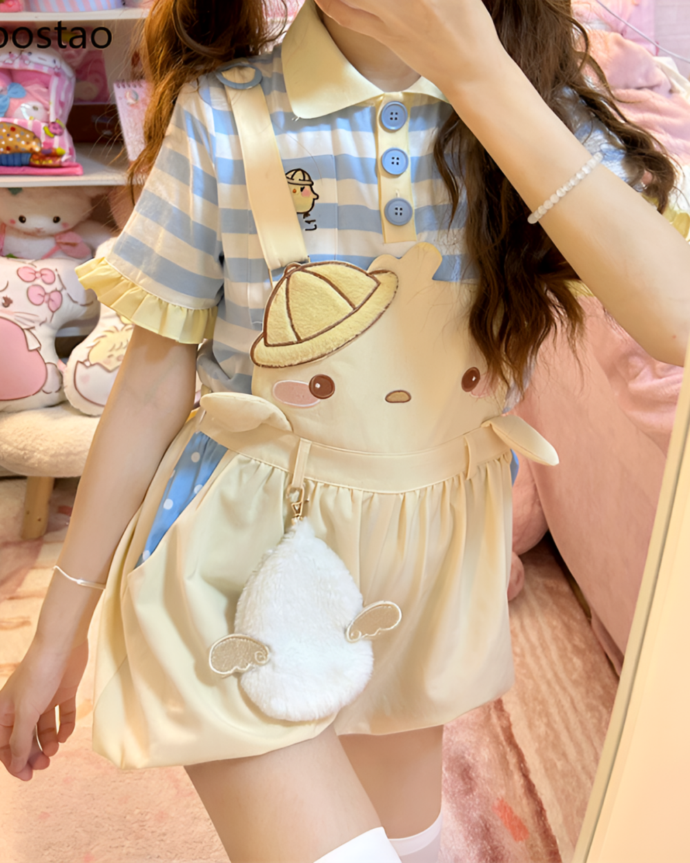 Model wearing the Sunbeam Mascot yellow suspender outfit, featuring a striped top and a fluffy bag. Cute cartoon design.
