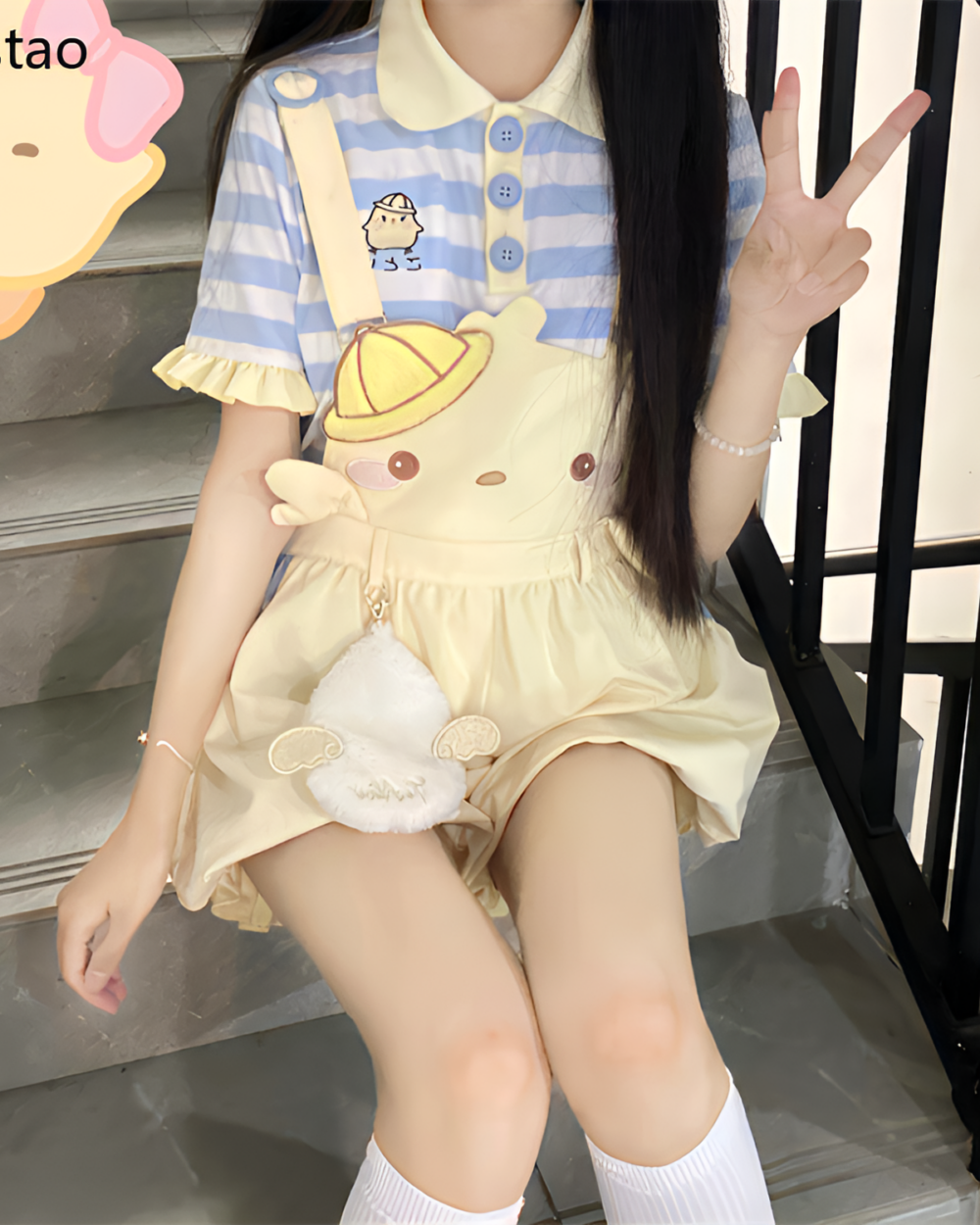 Model wearing a Sunbeam Mascot yellow suspender outfit with a cute design, paired with knee-high socks.