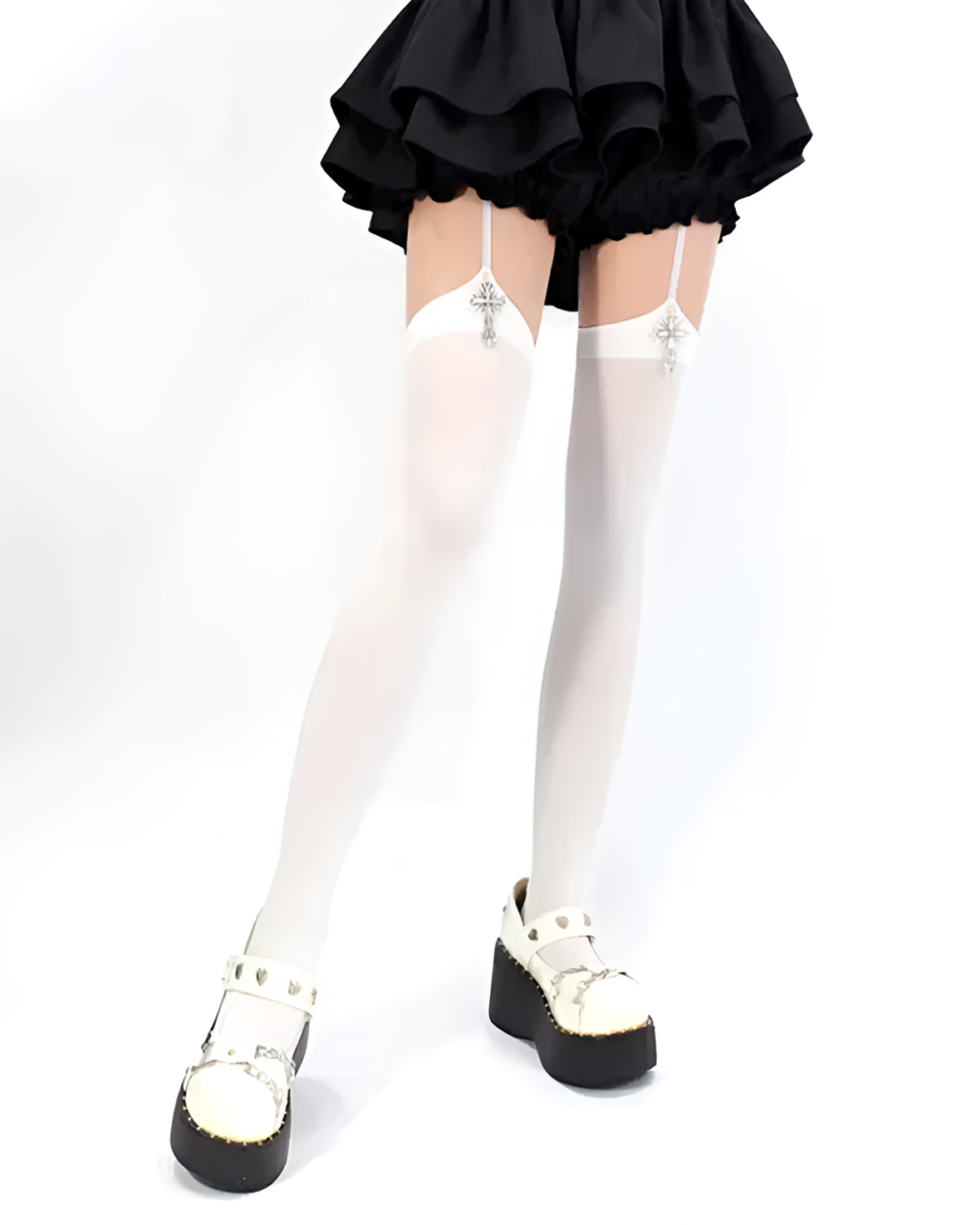 White suspender cross socks with lace trim, worn with a black skirt and platform shoes.