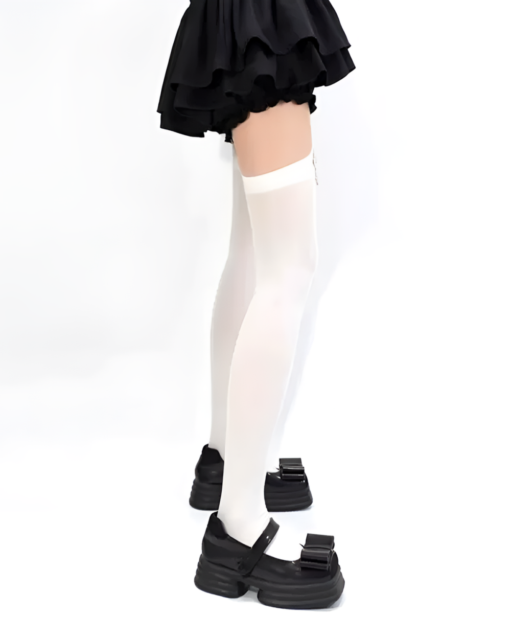 White suspender cross socks worn with a black skirt and shoes.