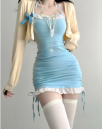 Sweet Girl Mini Dress - Dollette Aesthetic in light blue with a beige cardigan and thigh-high socks.